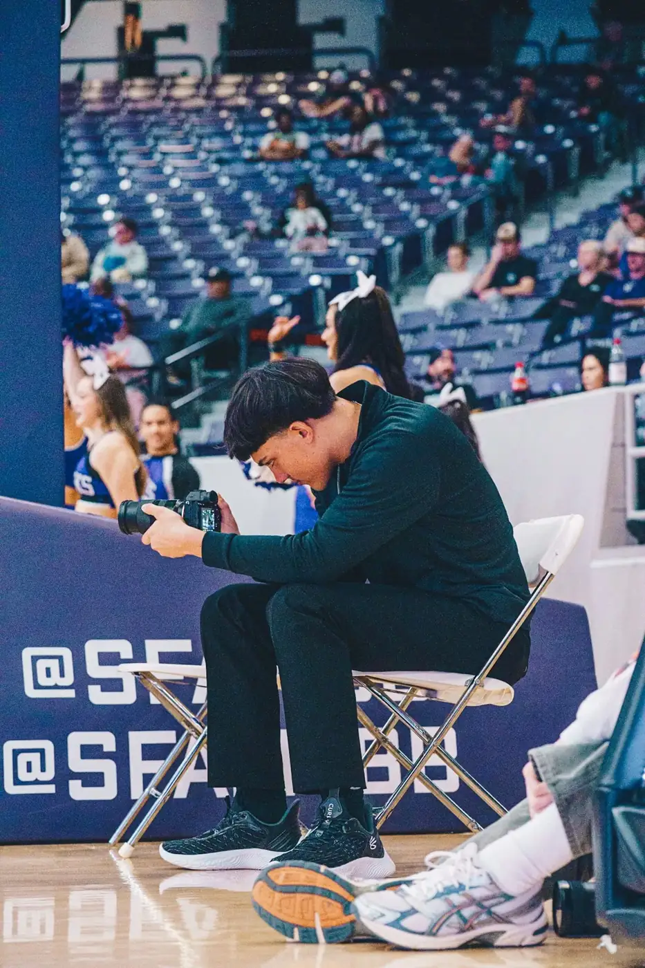 Behind the camera, courtside