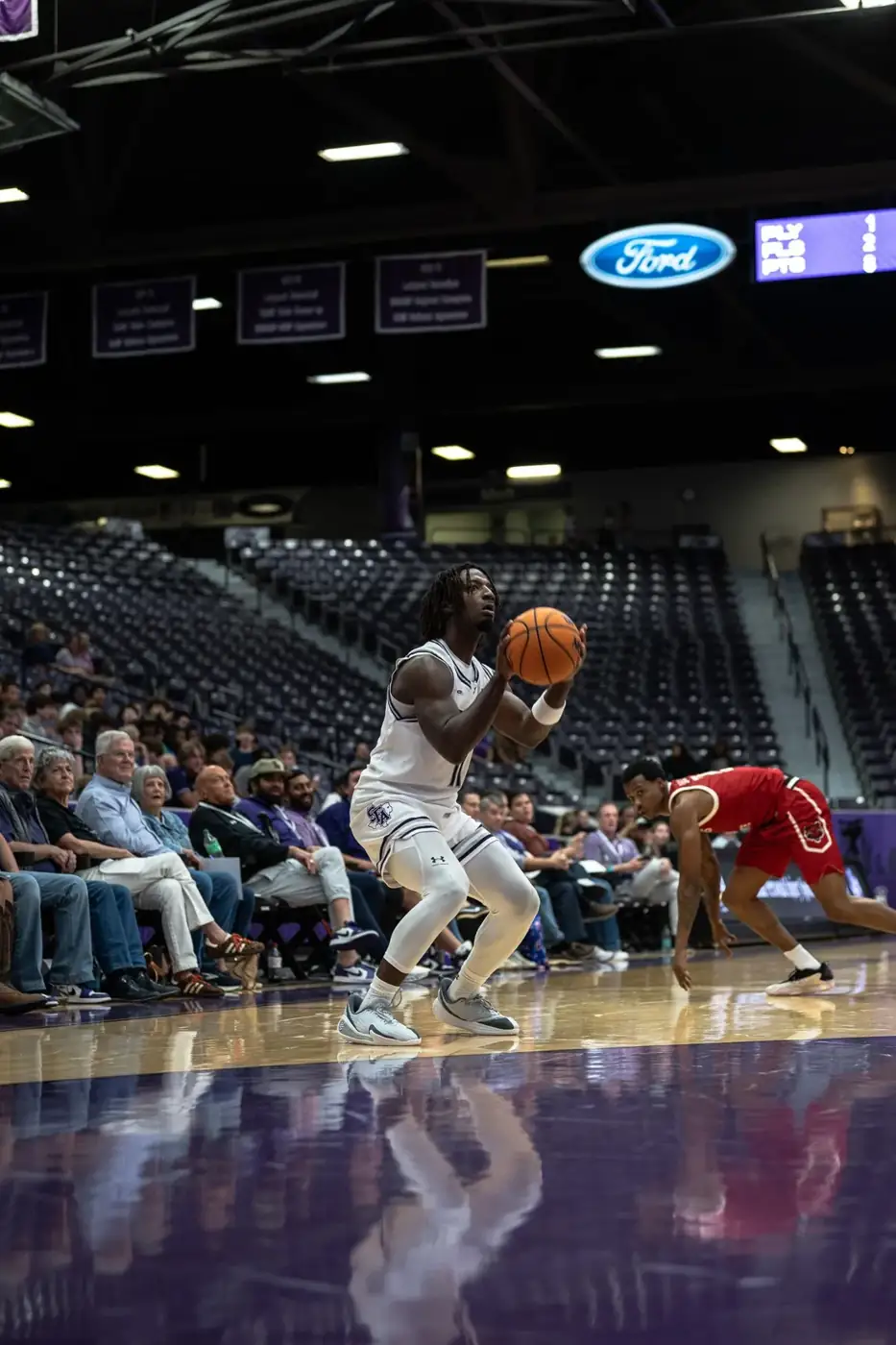 SFA basketball player preparing to shoot